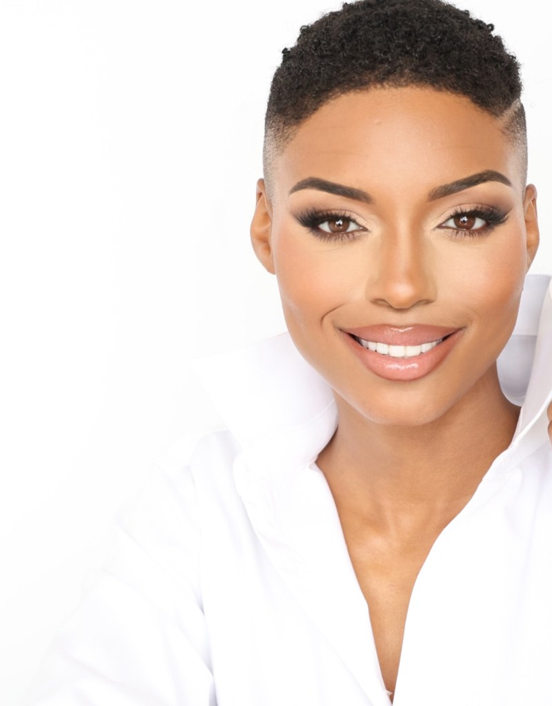 Portrait of Lena Pringle in a white blouse against a white background.